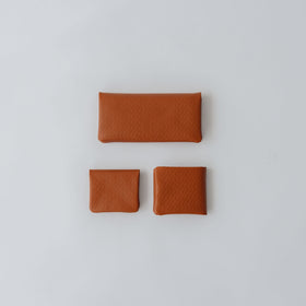 COSMIC WONDER monogram embossed light leather bifold wallet